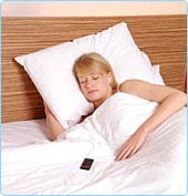 Woman listening to a Nodcast in bed
